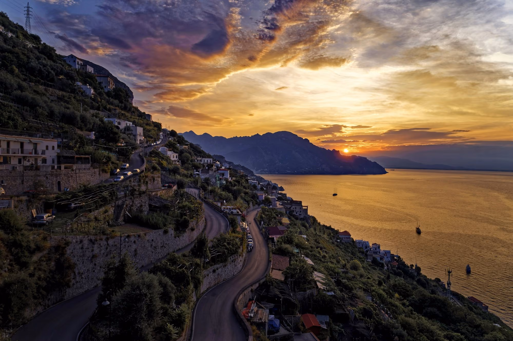 Near Borgo Santandrea: buildings on cliff near body of water