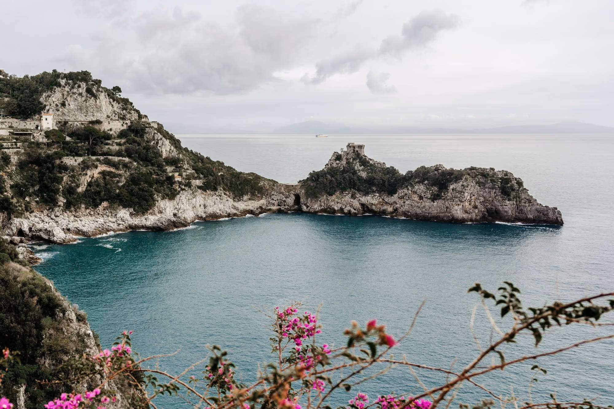 Near Hotel Miramalfi: body of water near mountain under white clouds during daytime