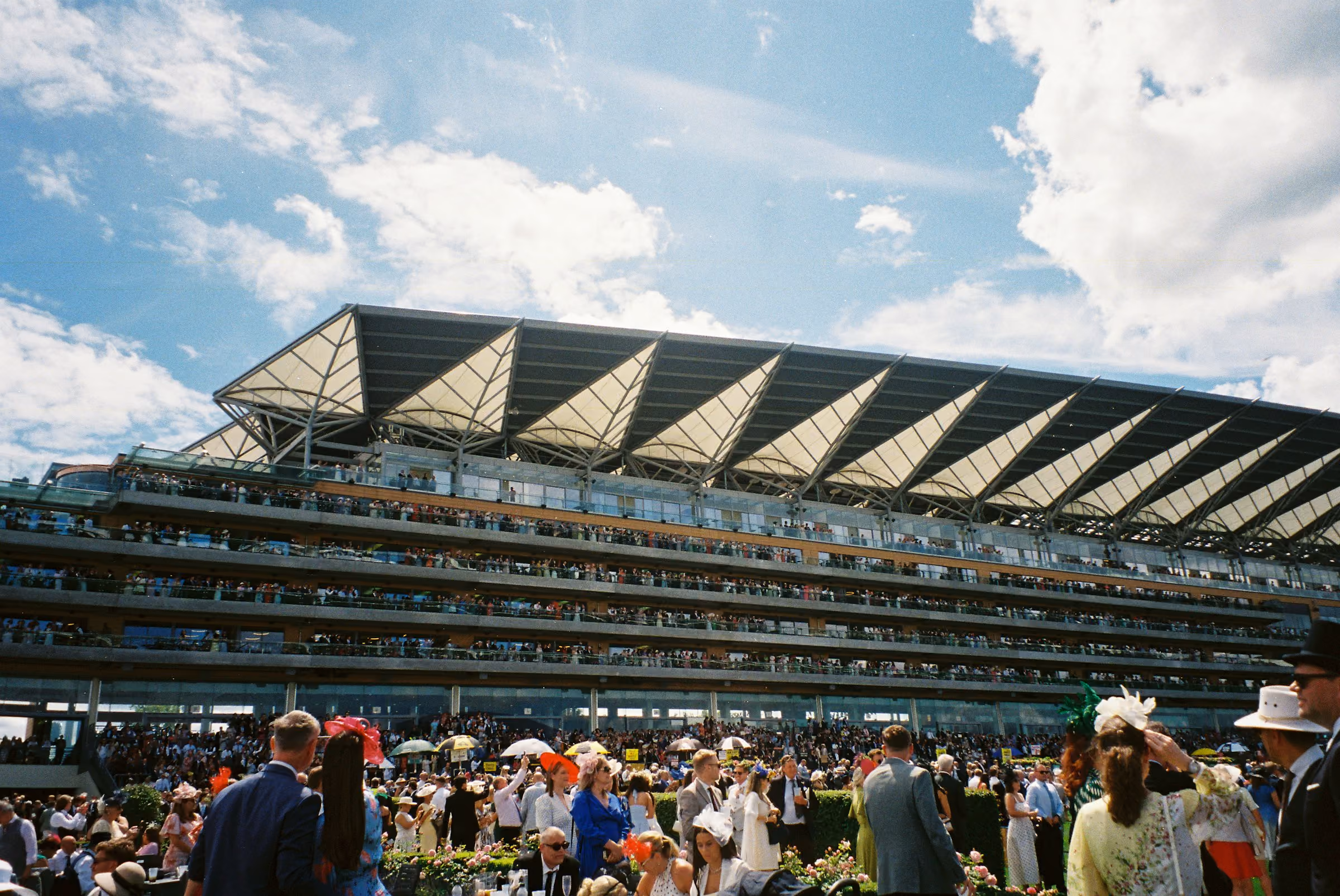 The Ascot grandstand packed with racegoers on a sunny race day