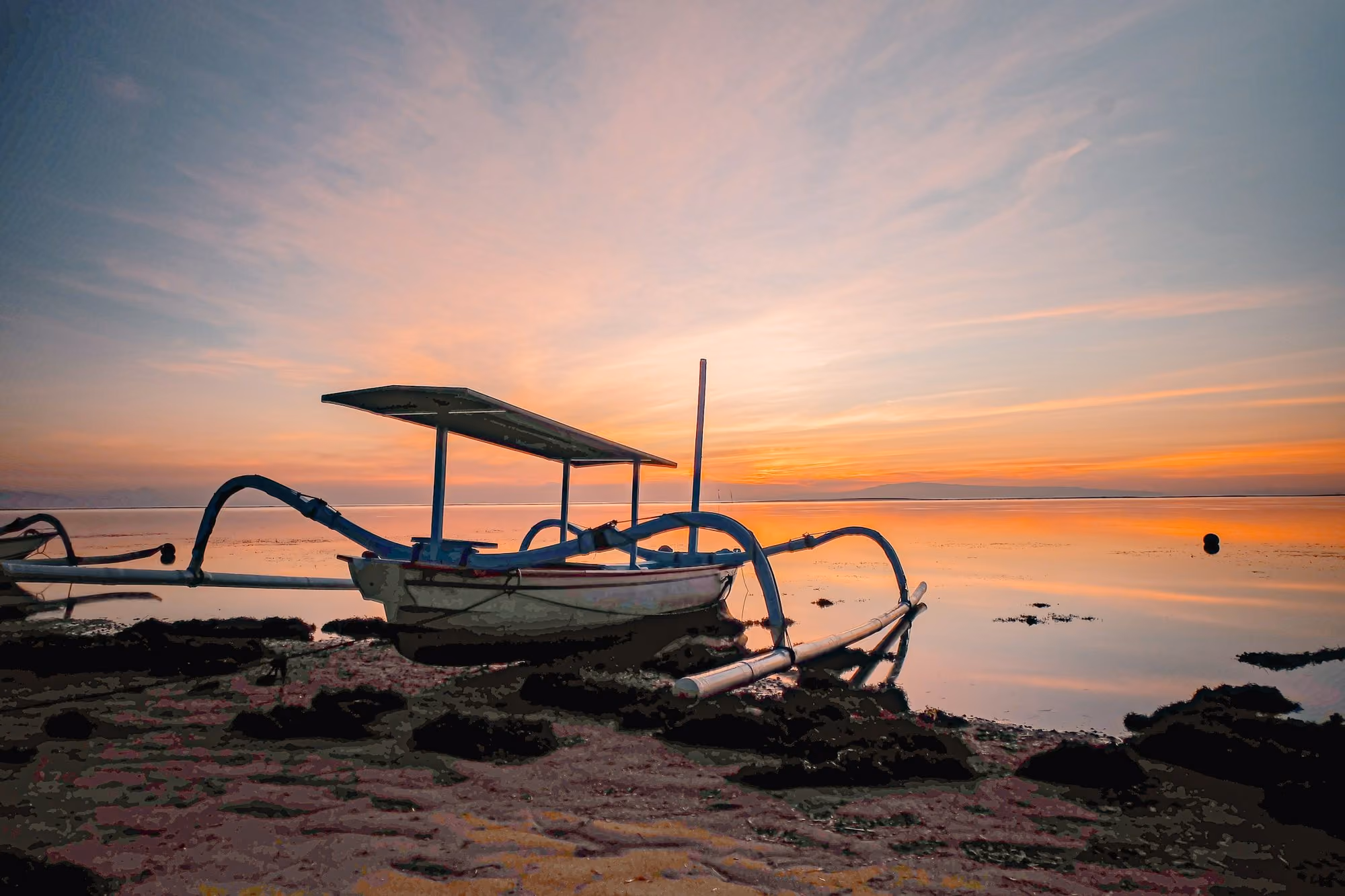 Near Andaz Bali: A boat sitting on top of a beach next to the ocean