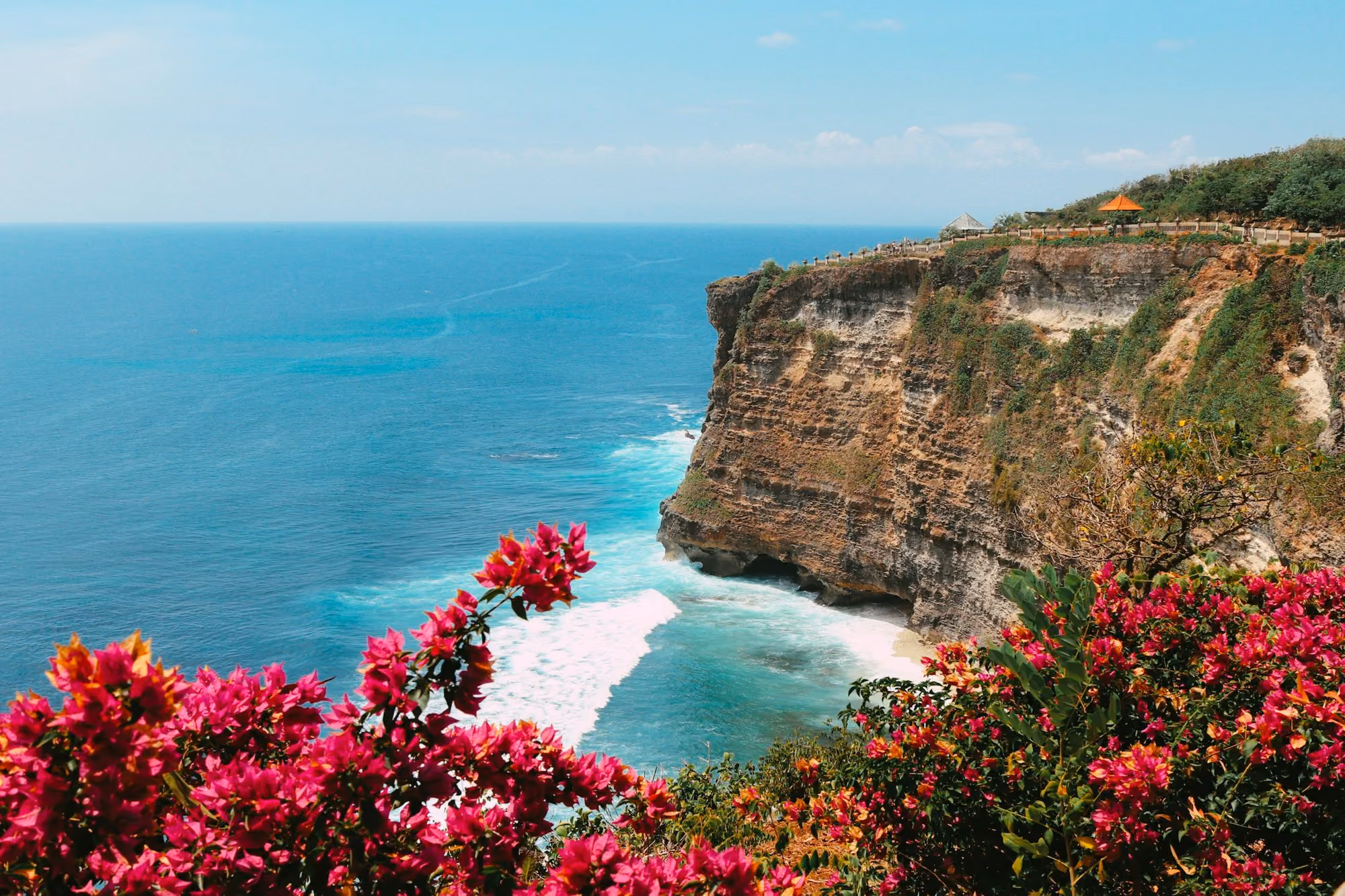 Near Bvlgari Resort Bali: brown rocky mountain beside blue sea during daytime