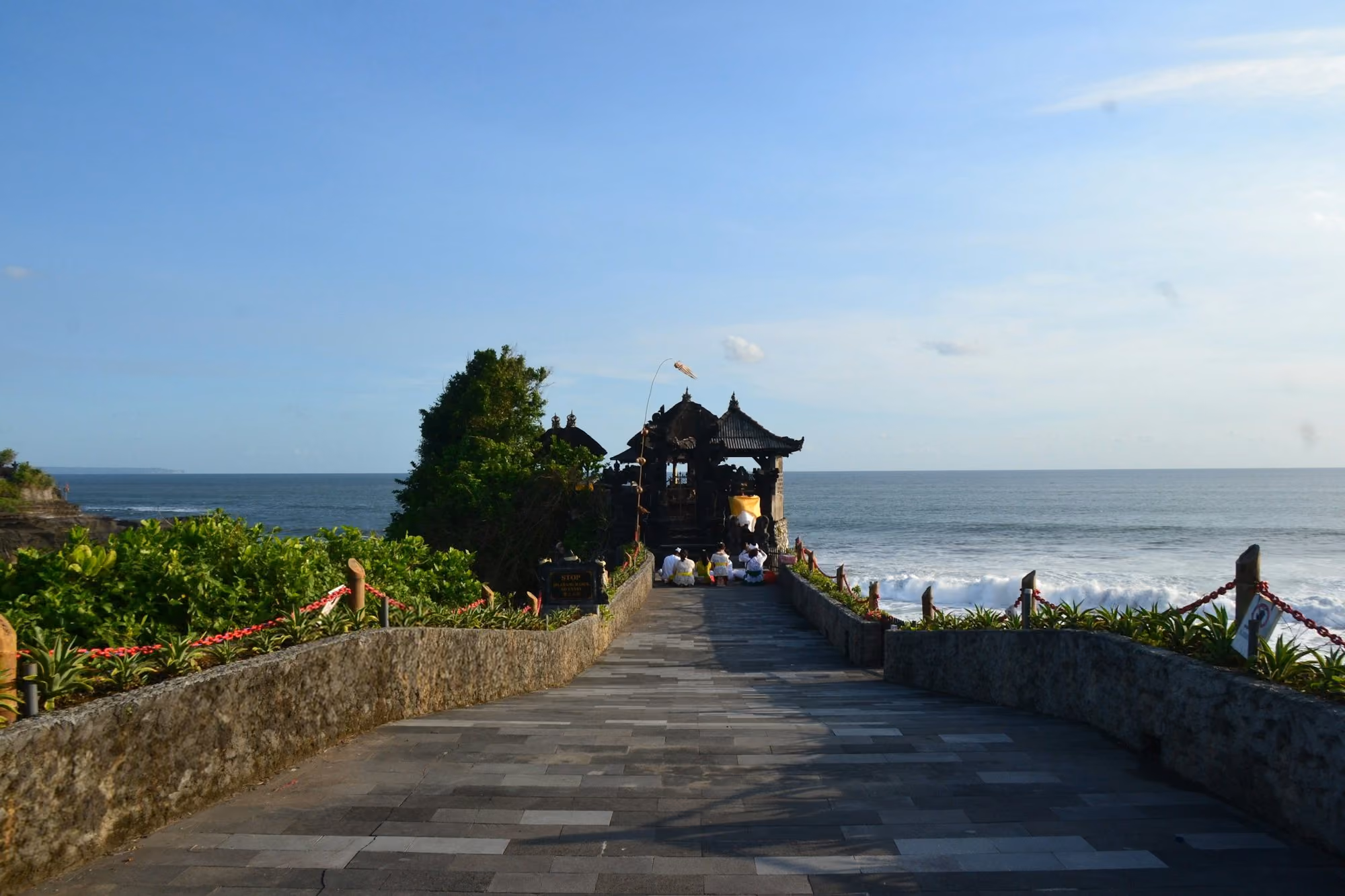 Near La Reserve 1785 Canggu: A temple pathway leads to the ocean