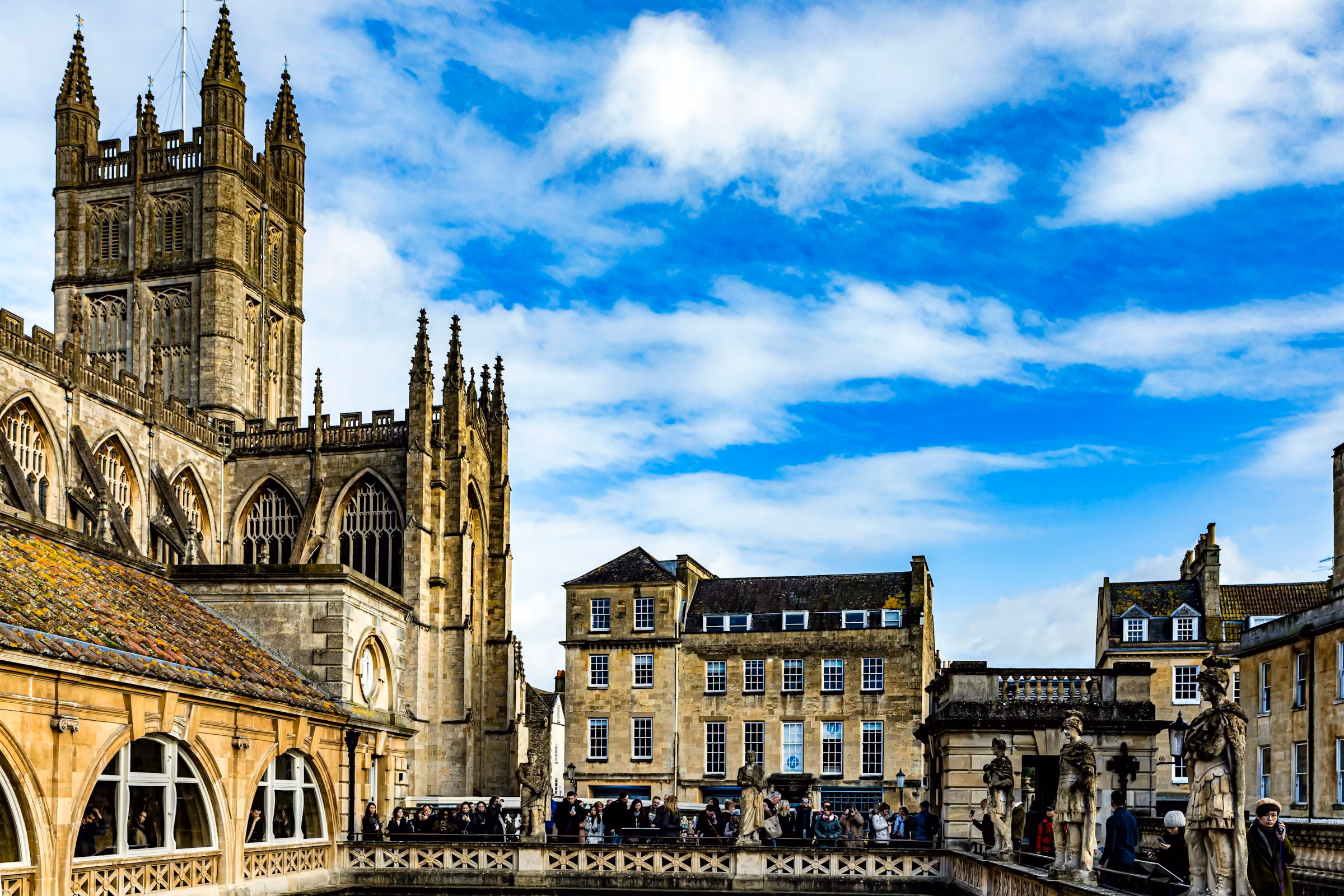 Bath Abbey and the Pump Room around the Abbey Churchyard on a bright day