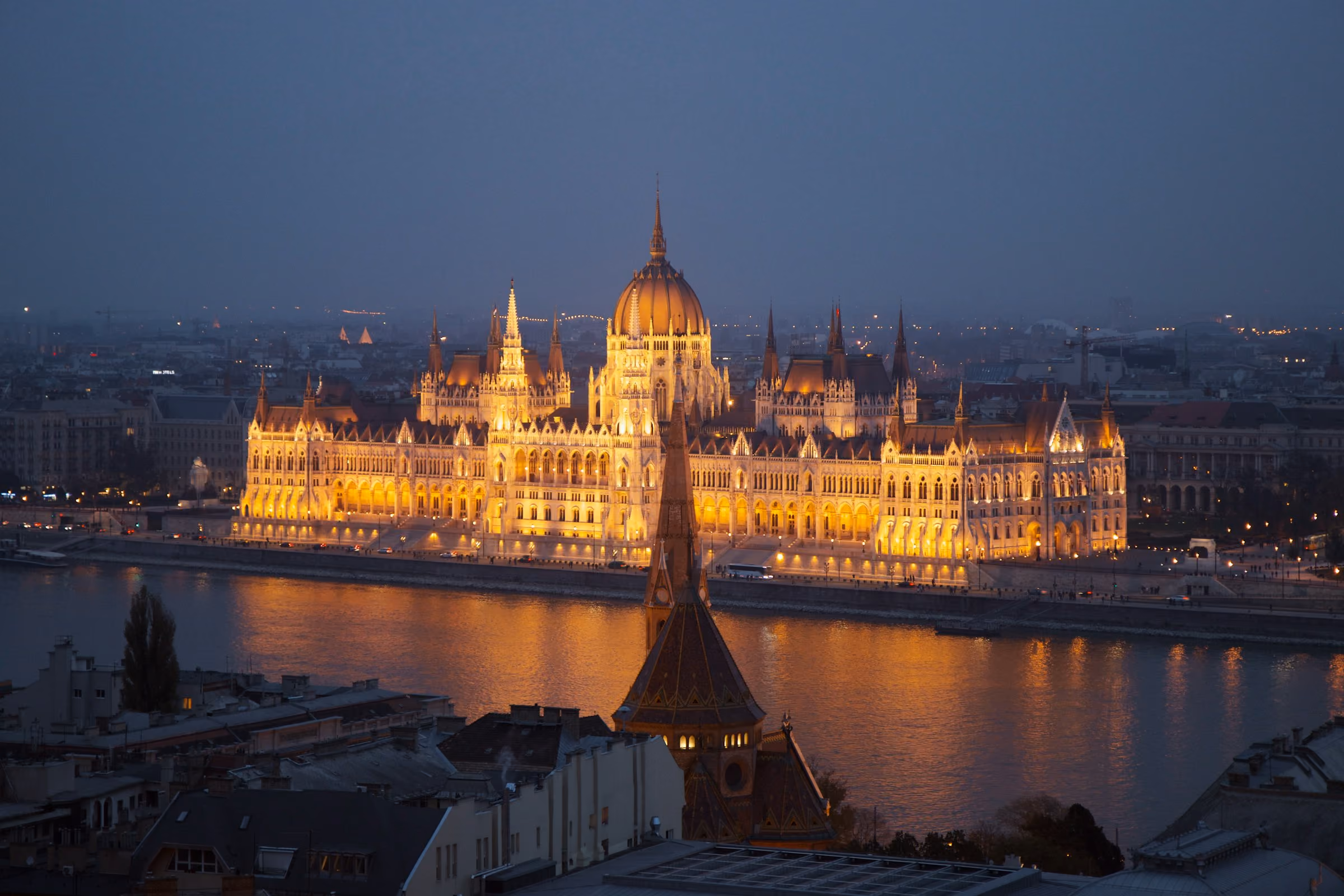 Budapest's Parliament lit at night across the Danube