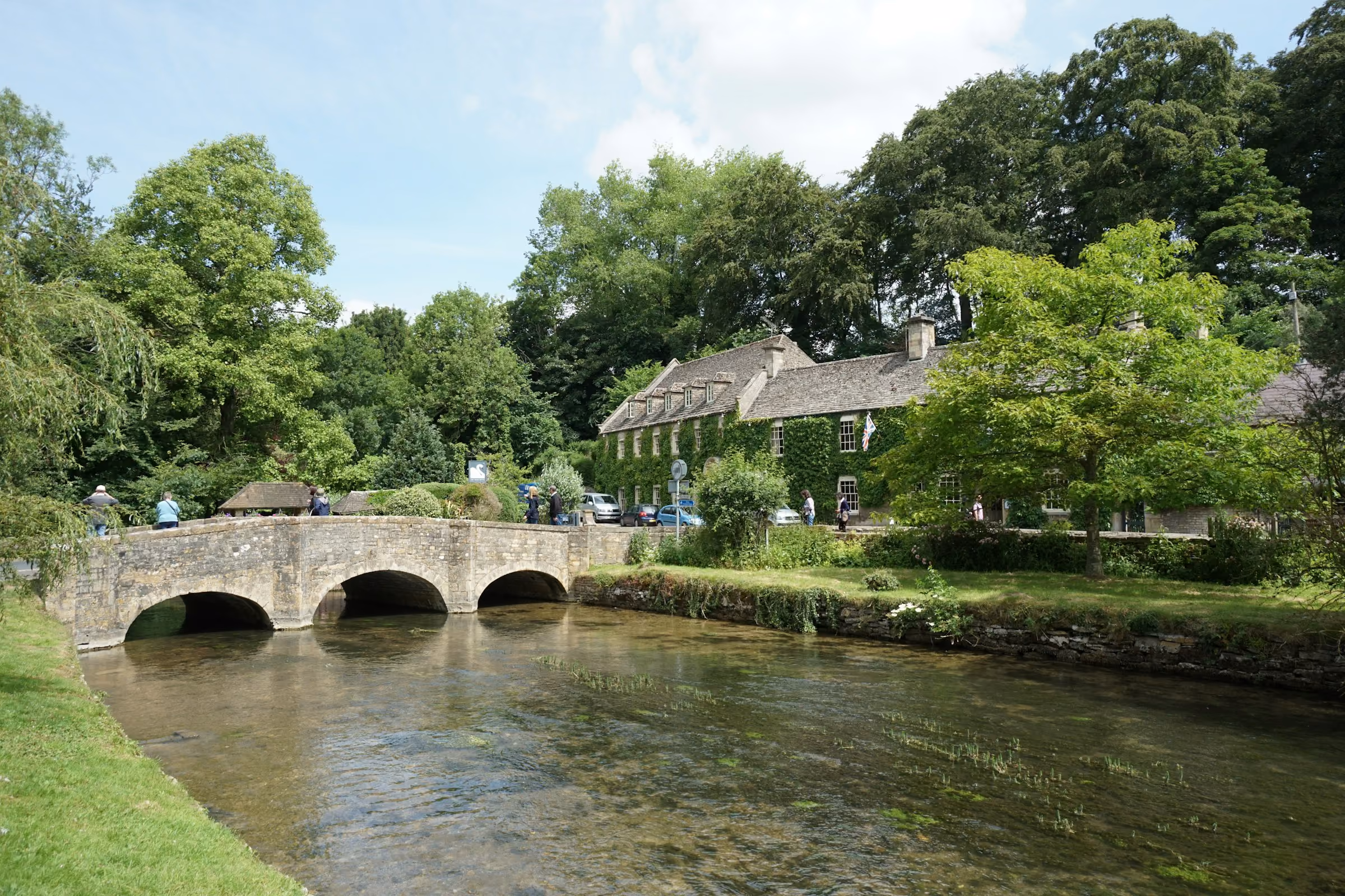 An old stone footbridge over a Cotswold river