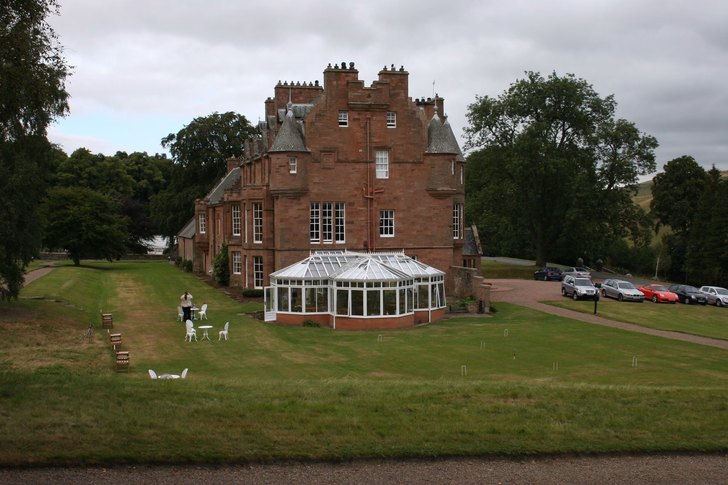 Cringletie House and its conservatory across the lawn