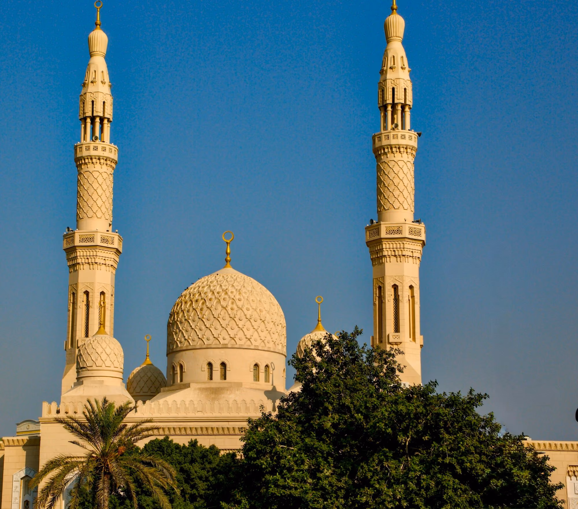 Near Mandarin Oriental Jumeira, Dubai: A large white building with two towers and a cross on top