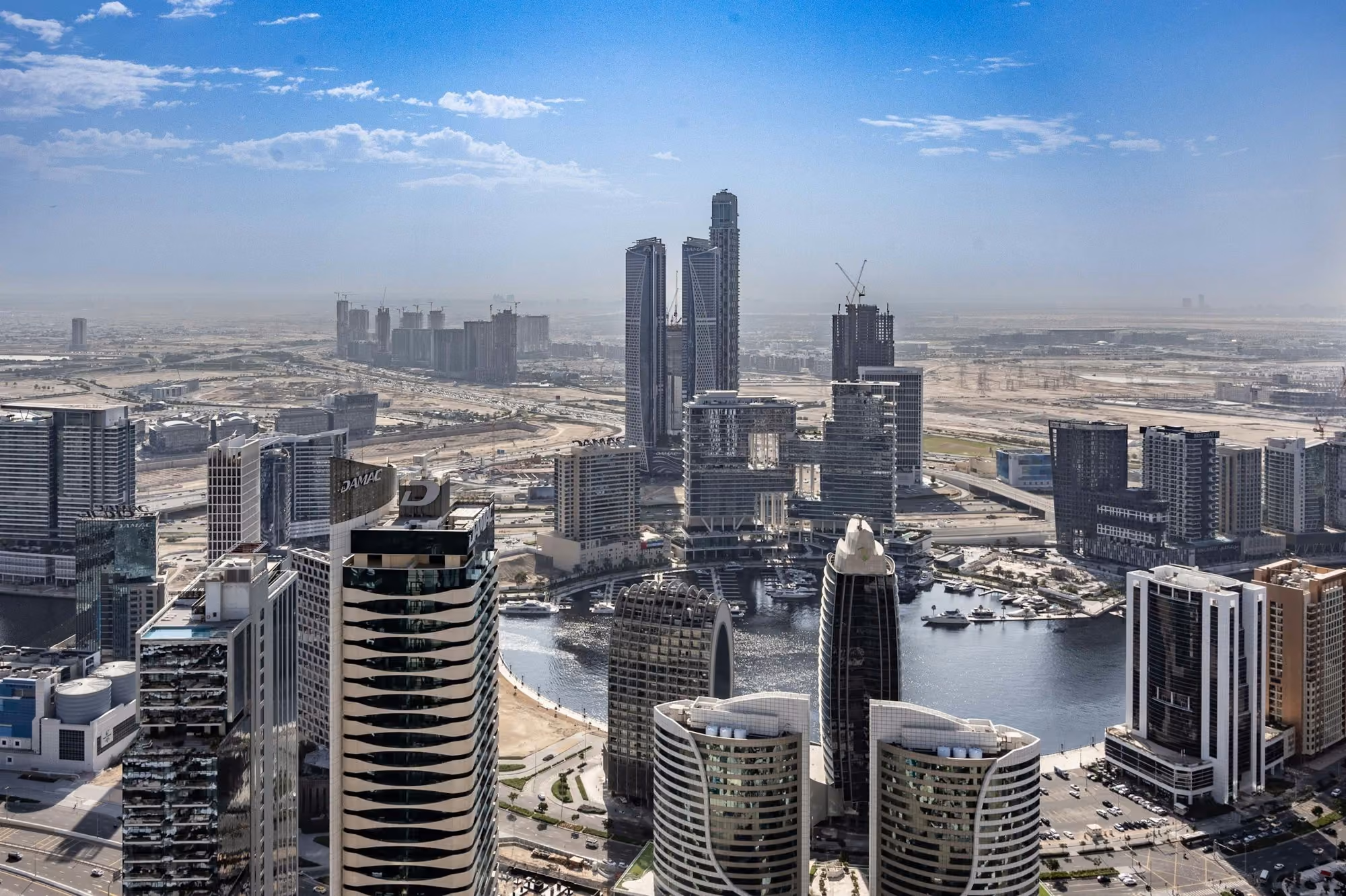 Near ME Dubai: An aerial view of a city with tall buildings