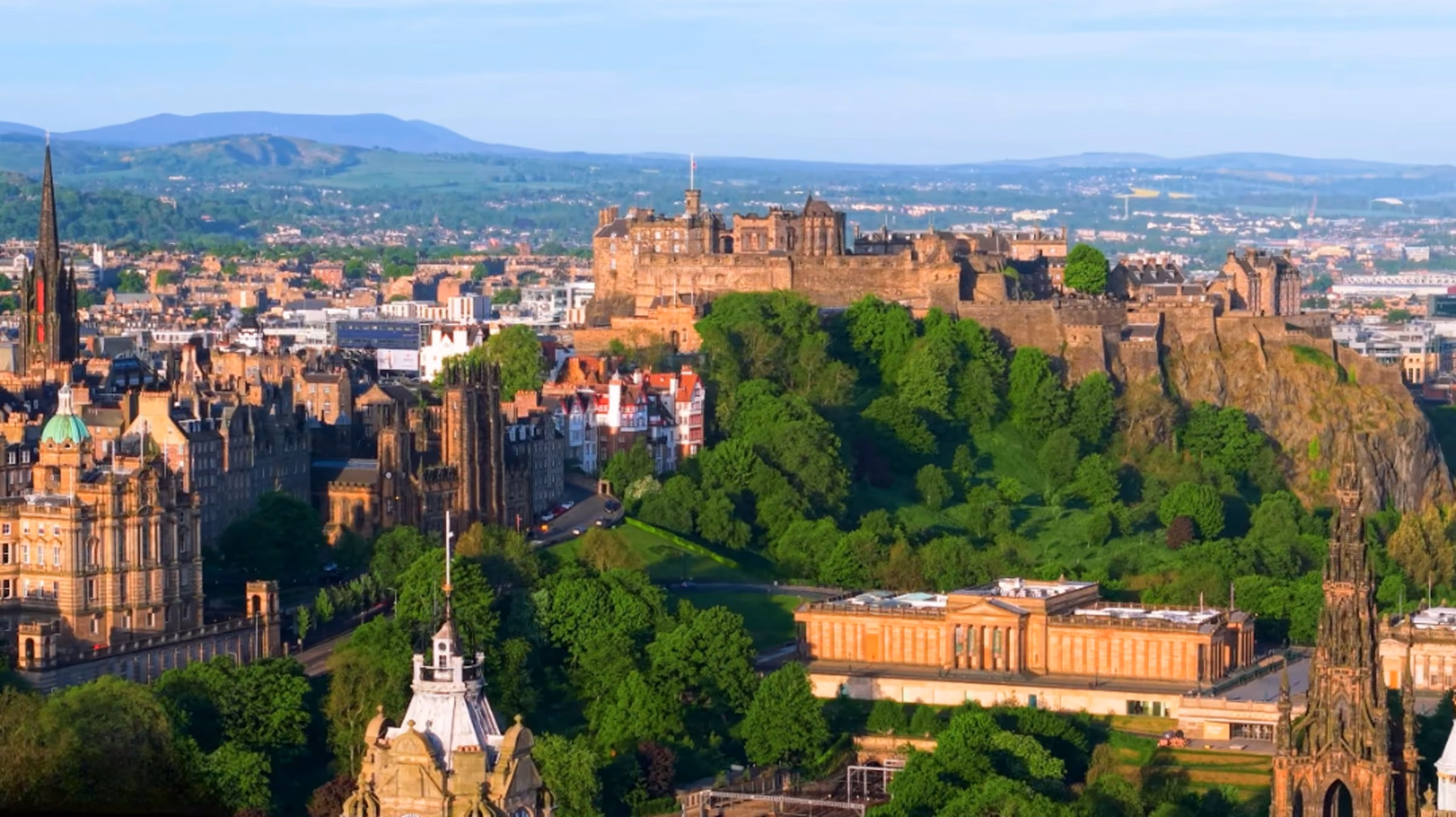 Edinburgh's Old Town and castle above the trees of Princes Street Gardens