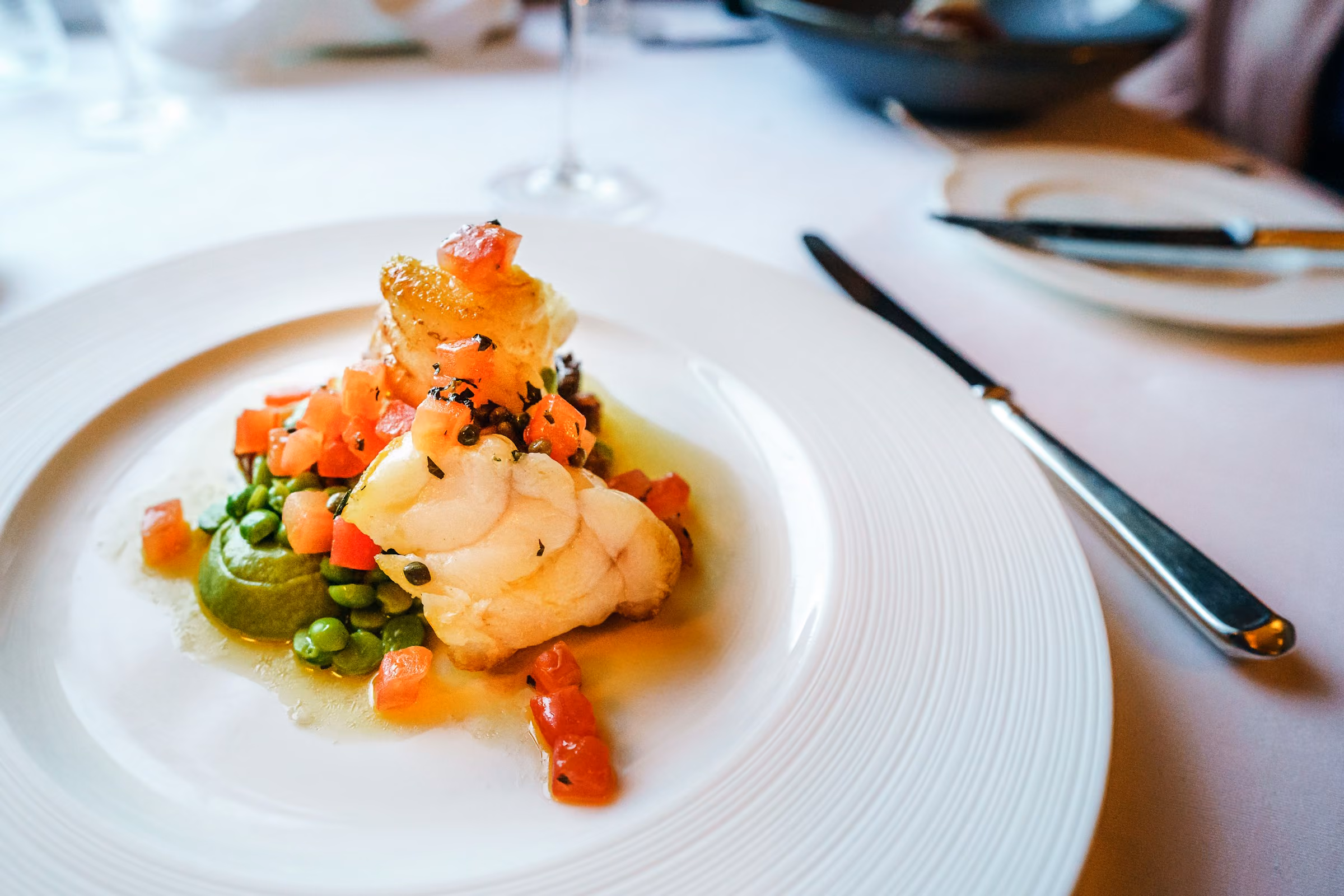 A seafood course on a white plate