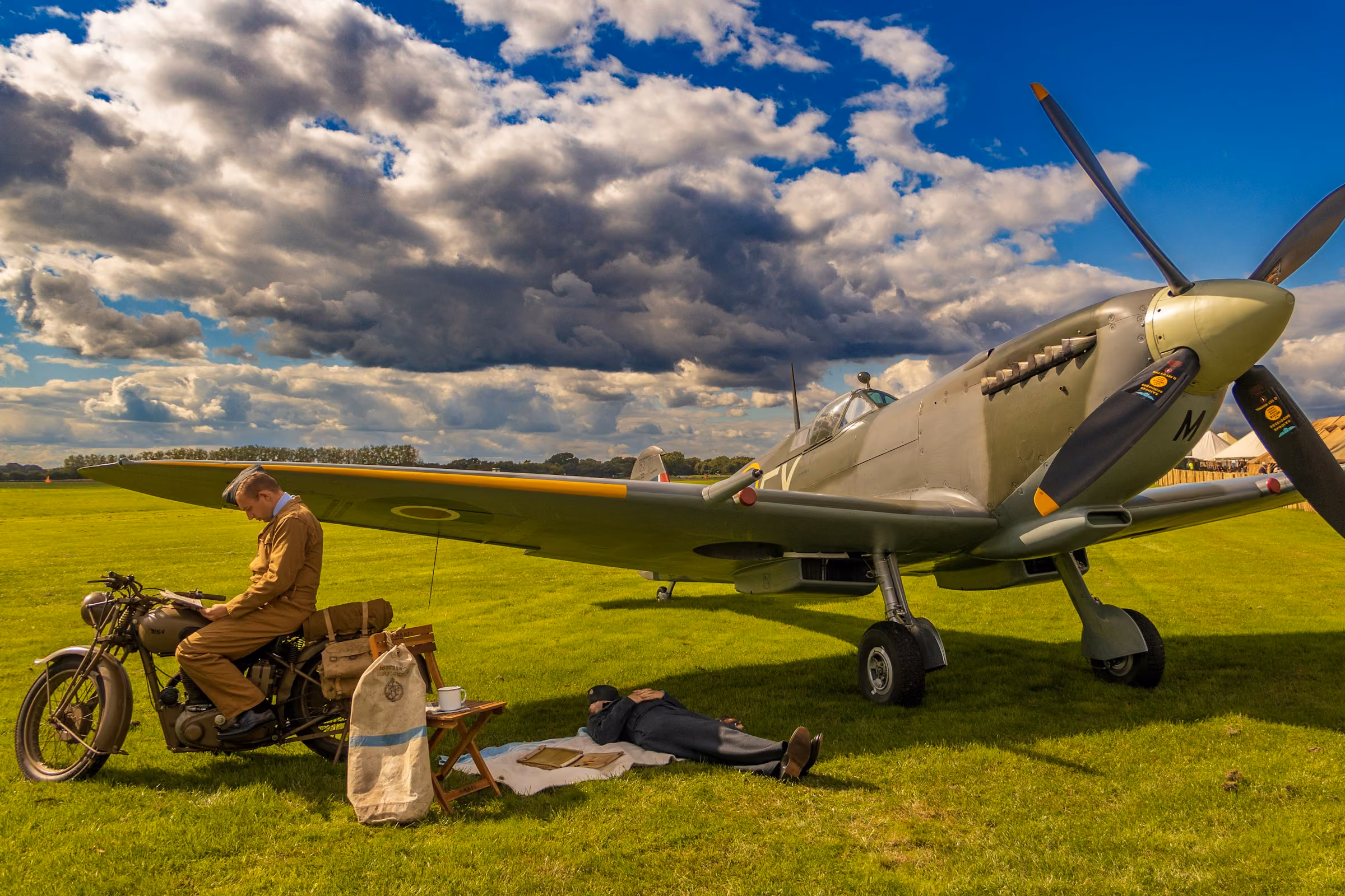 A Spitfire on a grass airfield