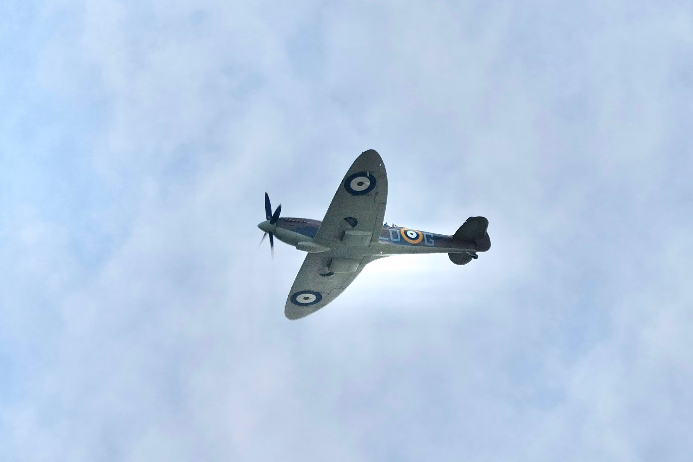 A Spitfire banking against cloud