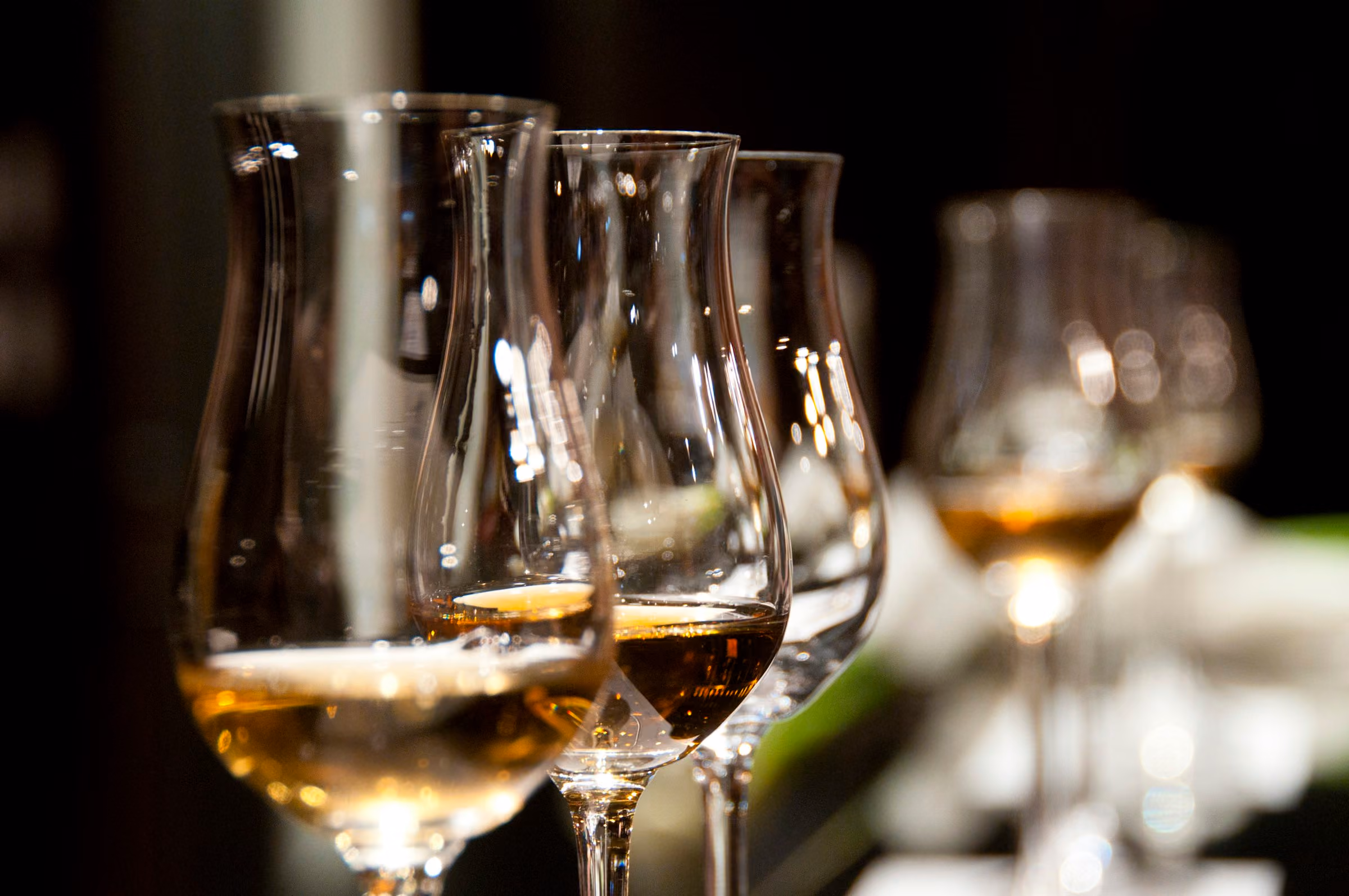 Whisky nosing glasses lit from behind
