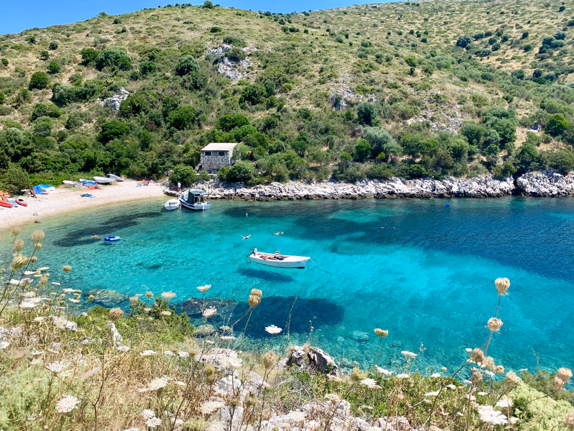 Near Villa Nai 3.3: white boat on body of water during daytime