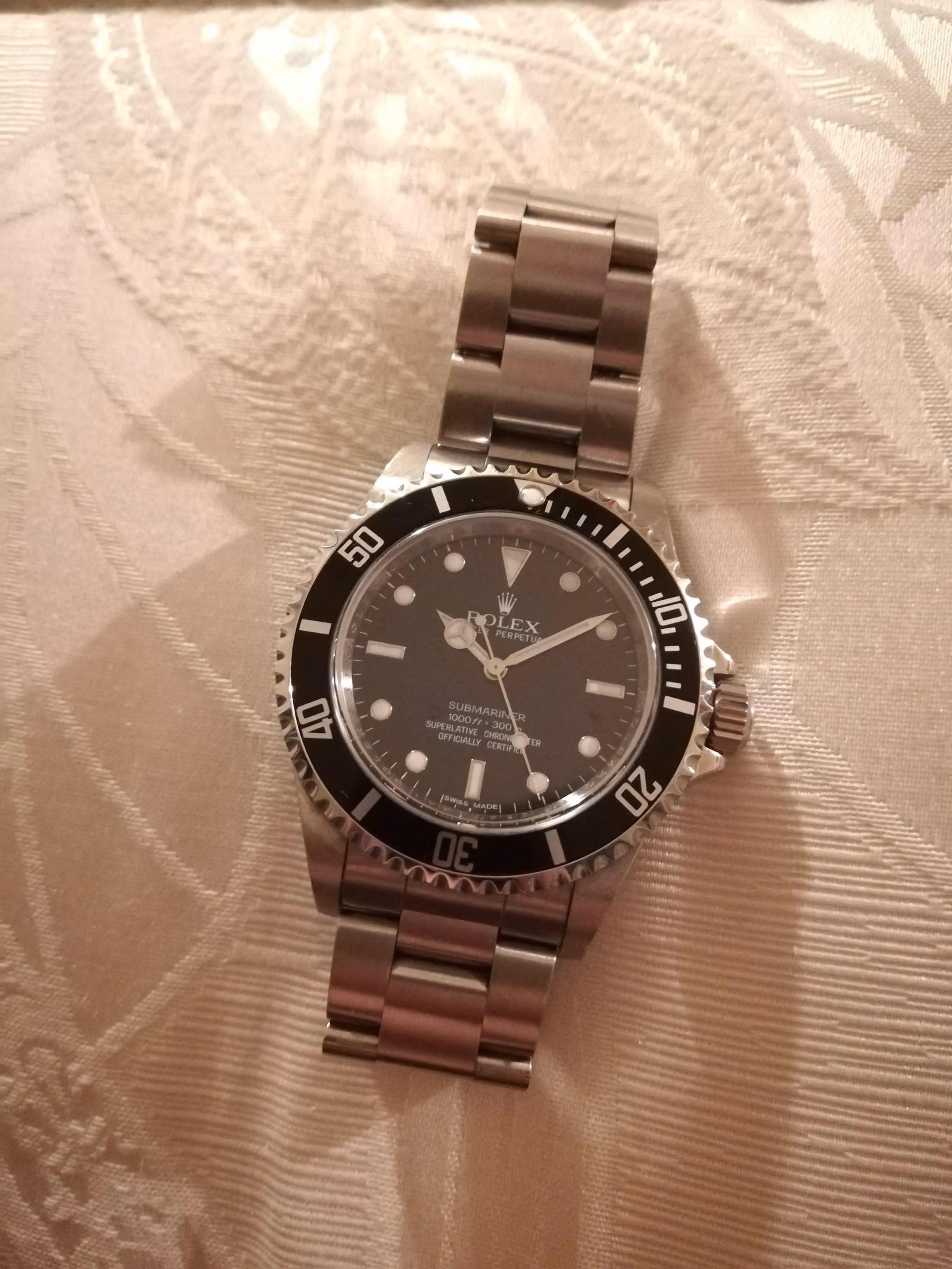 A Rolex Submariner 14060M, the no-date Submariner of the 2000s, on its Oyster bracelet