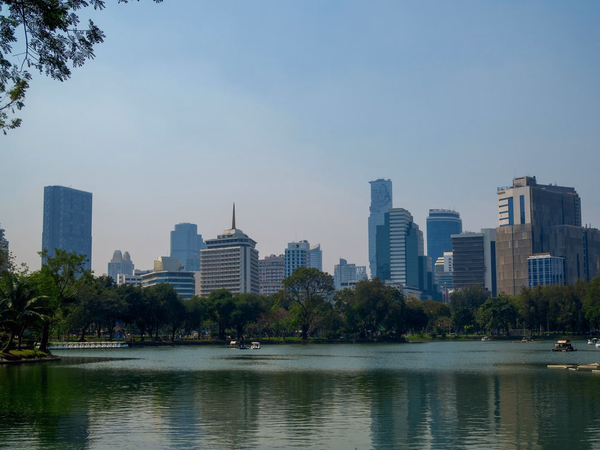 Near Aman Nai Lert Bangkok: city skyline across body of water during daytime