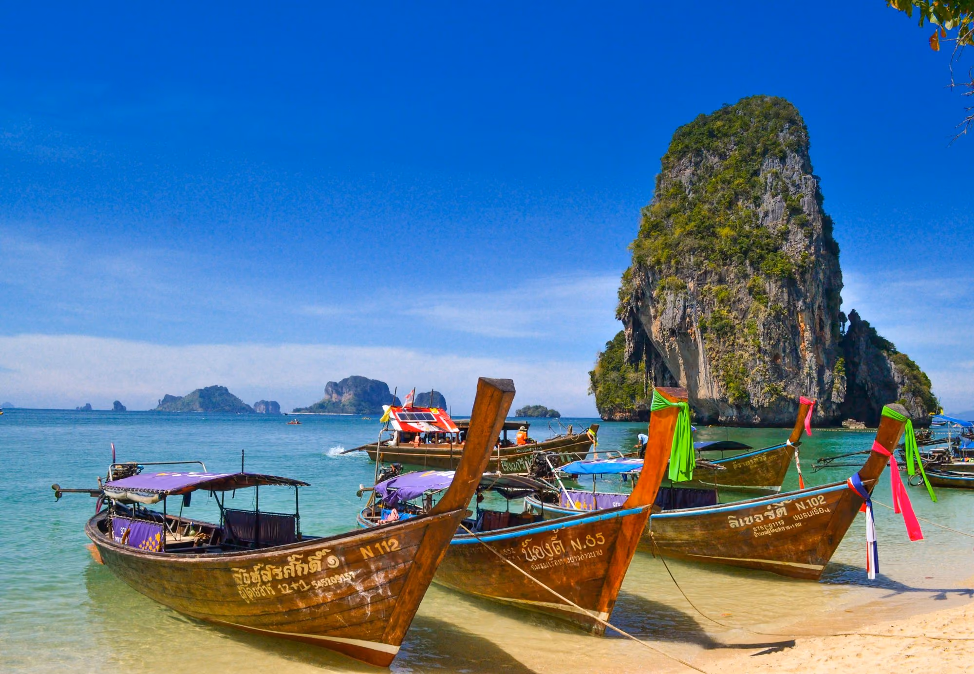 Near Phulay Bay, A Ritz-Carlton Reserve: five brown wooden boats