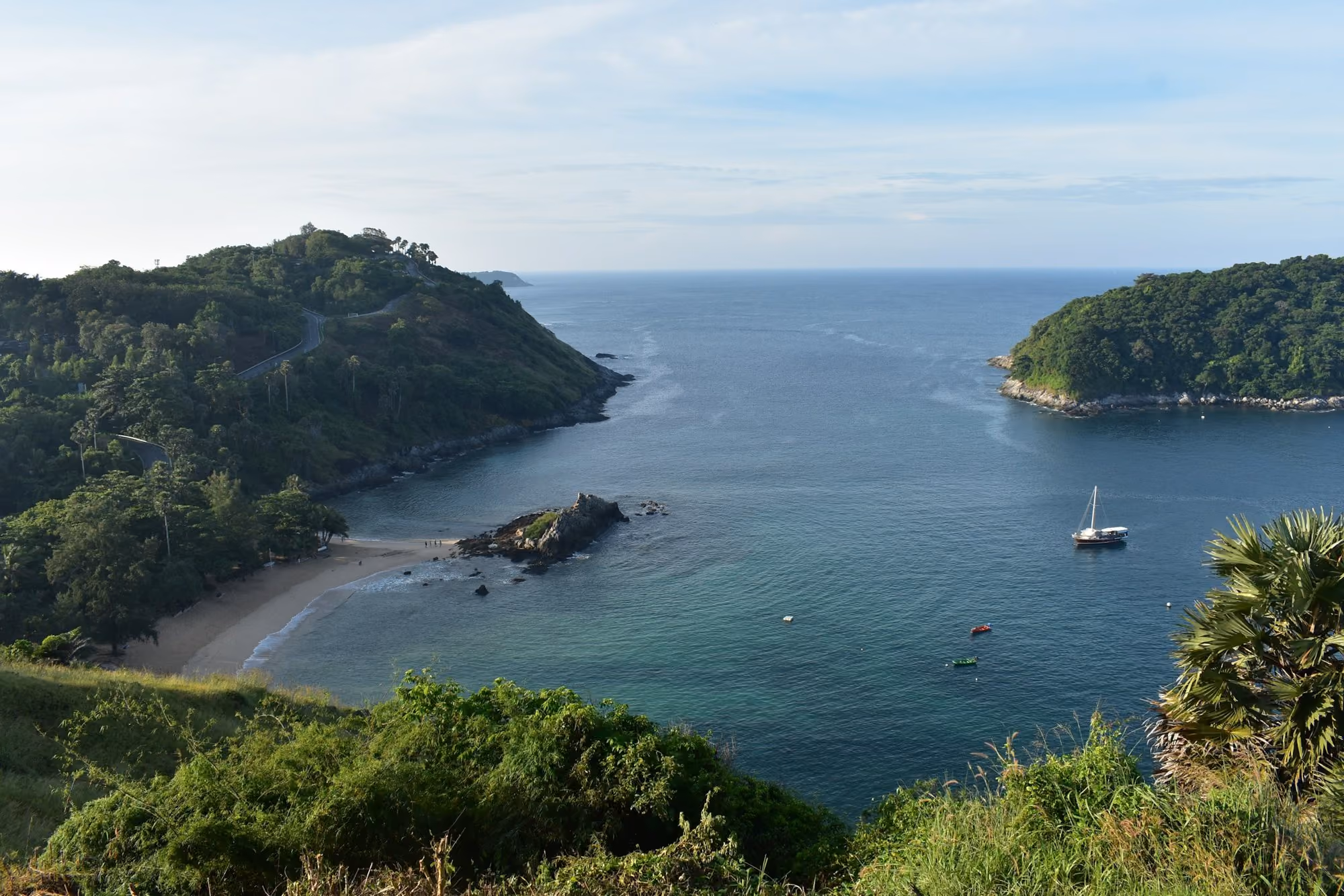 Near Rosewood Phuket: a body of water surrounded by lush green trees