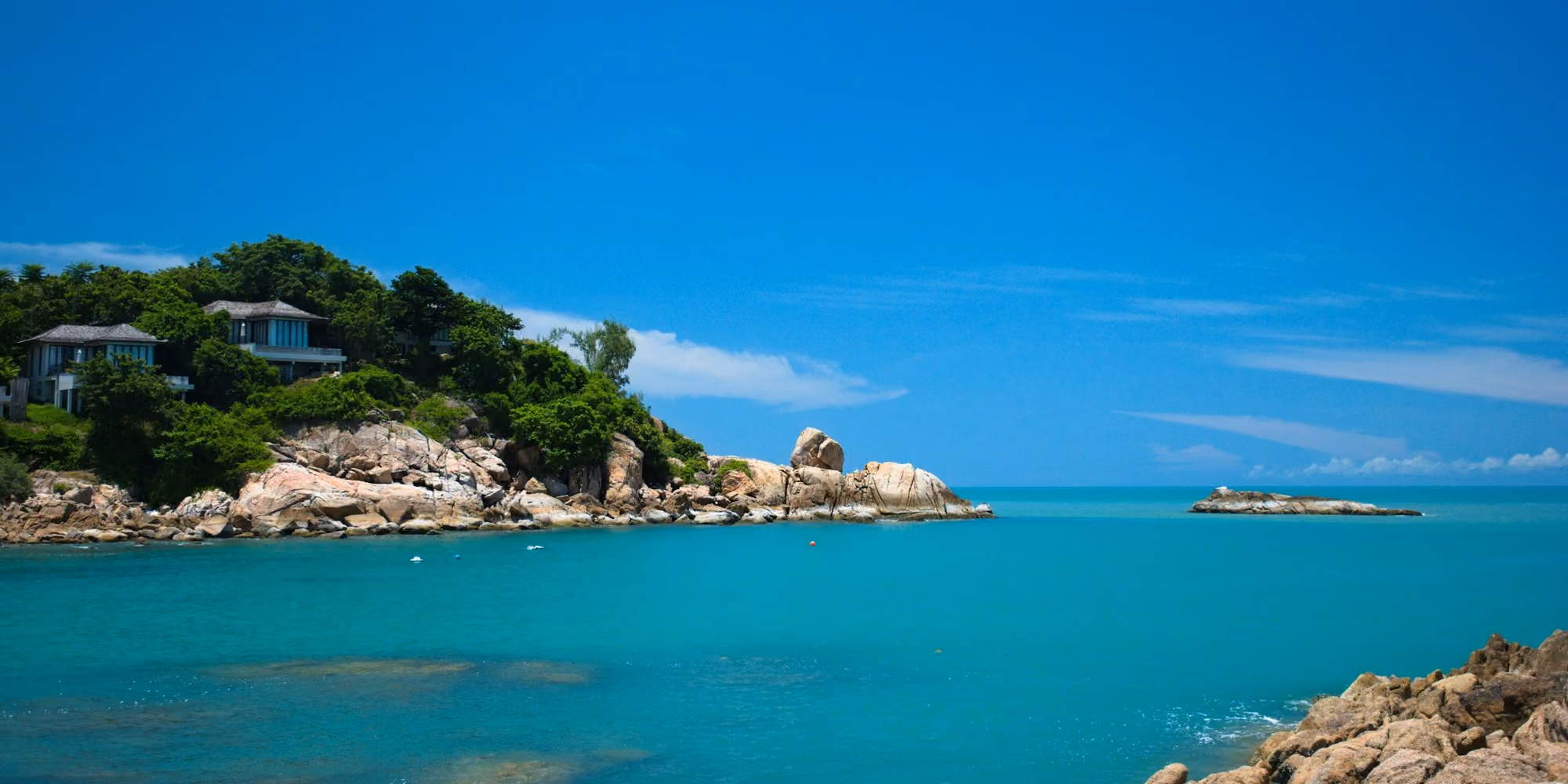 Near Six Senses Samui: a small island with a house on it