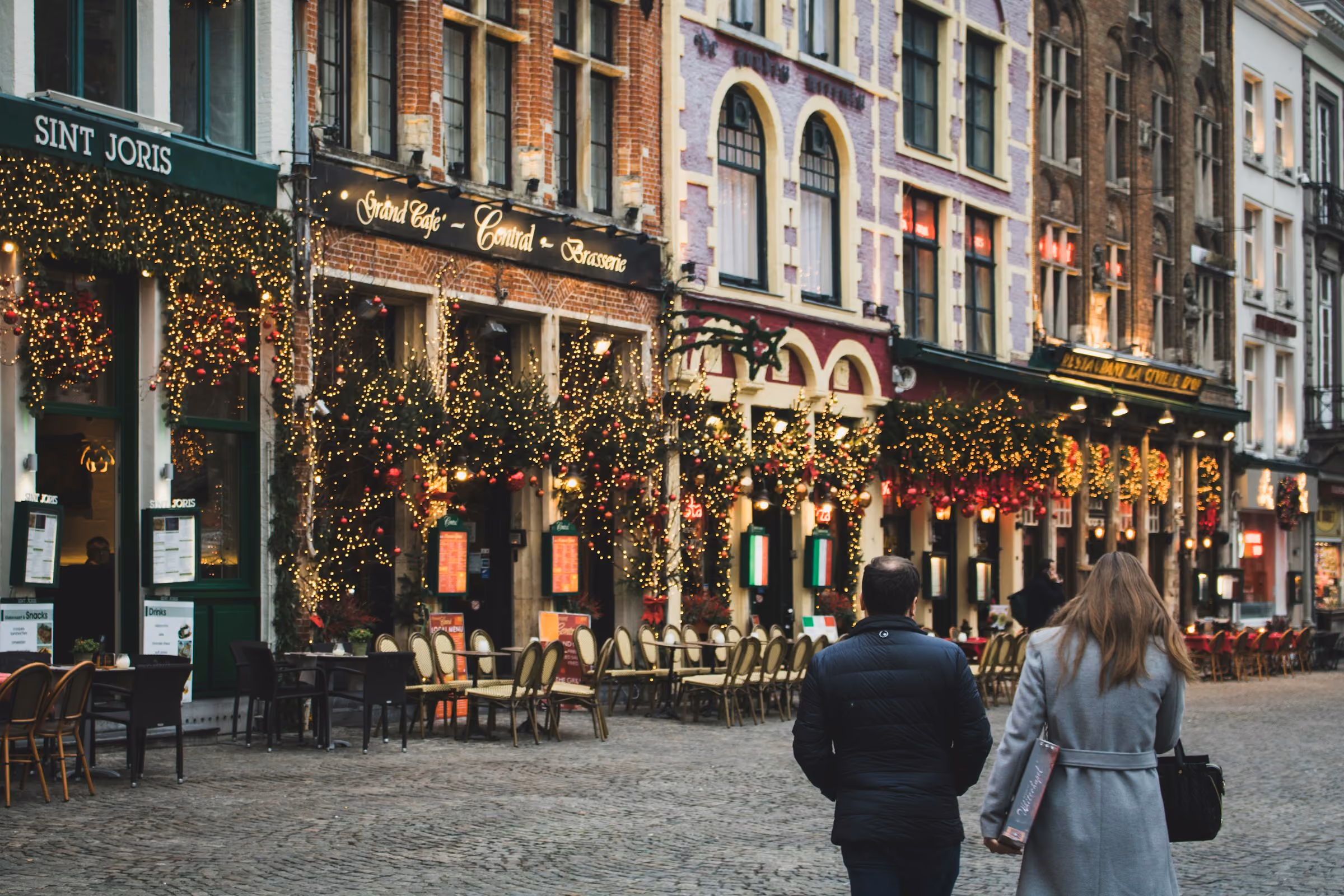 A Bruges street hung with Christmas lights