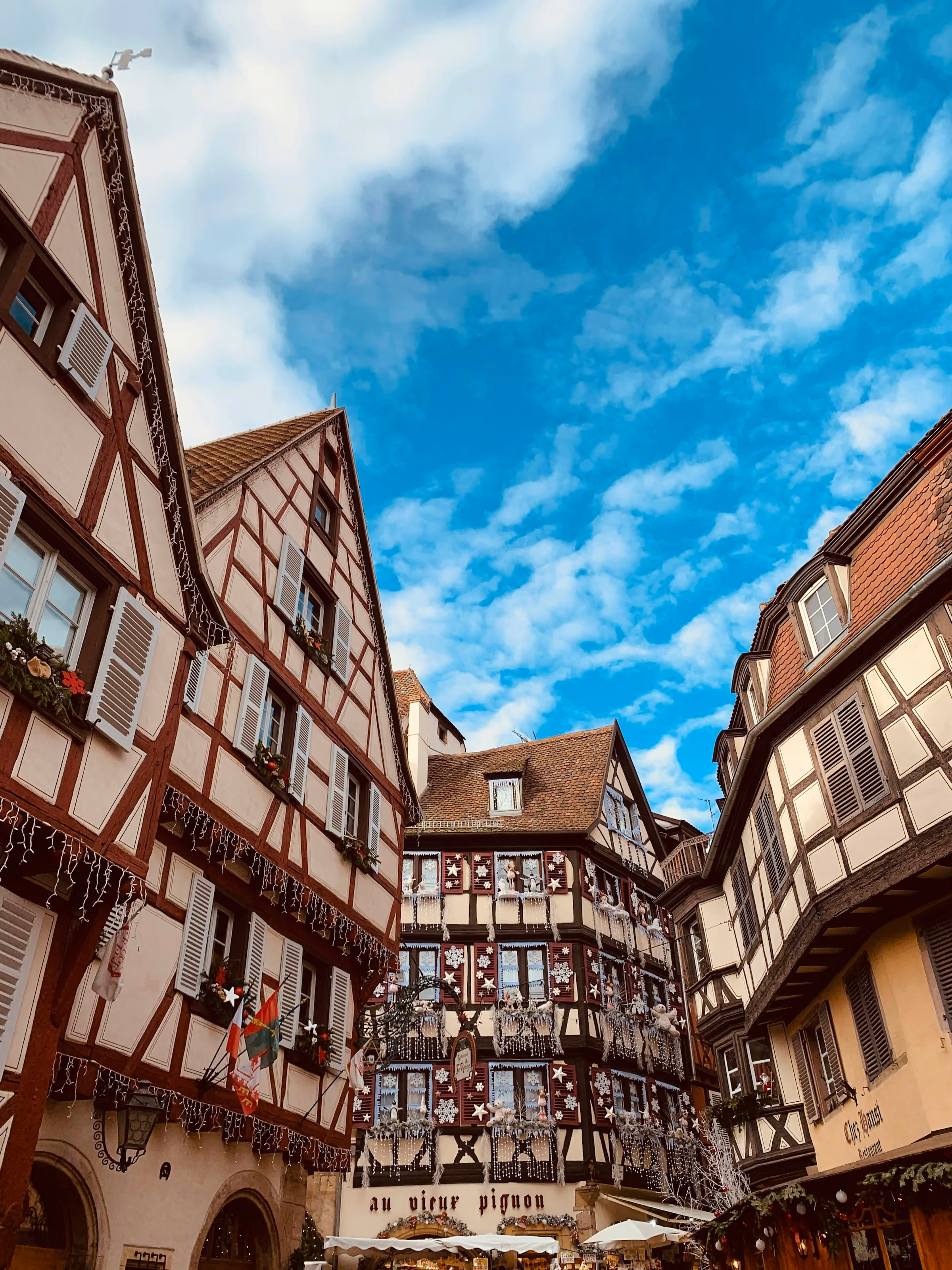 Half-timbered houses under a blue winter sky in Alsace