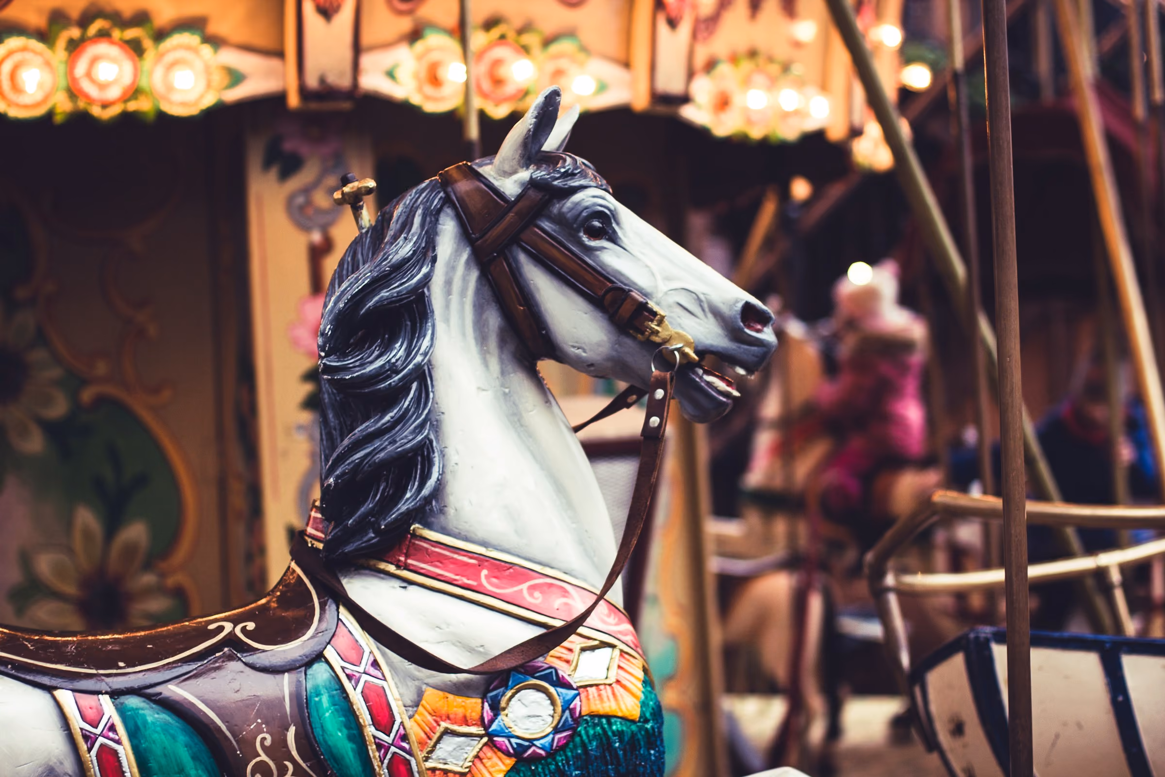 A painted horse on a Christmas market carousel