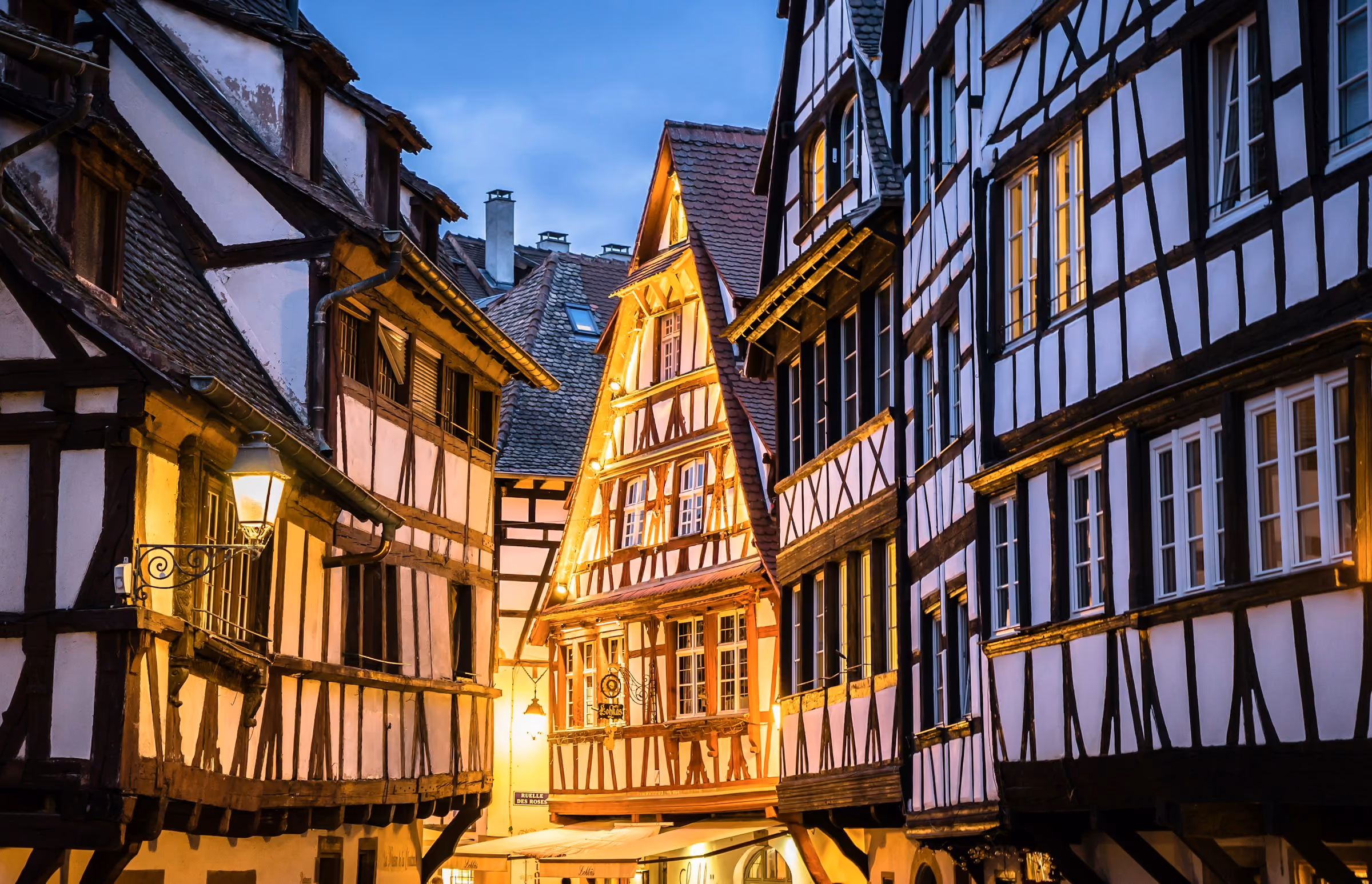Half-timbered houses lit up in Strasbourg at night