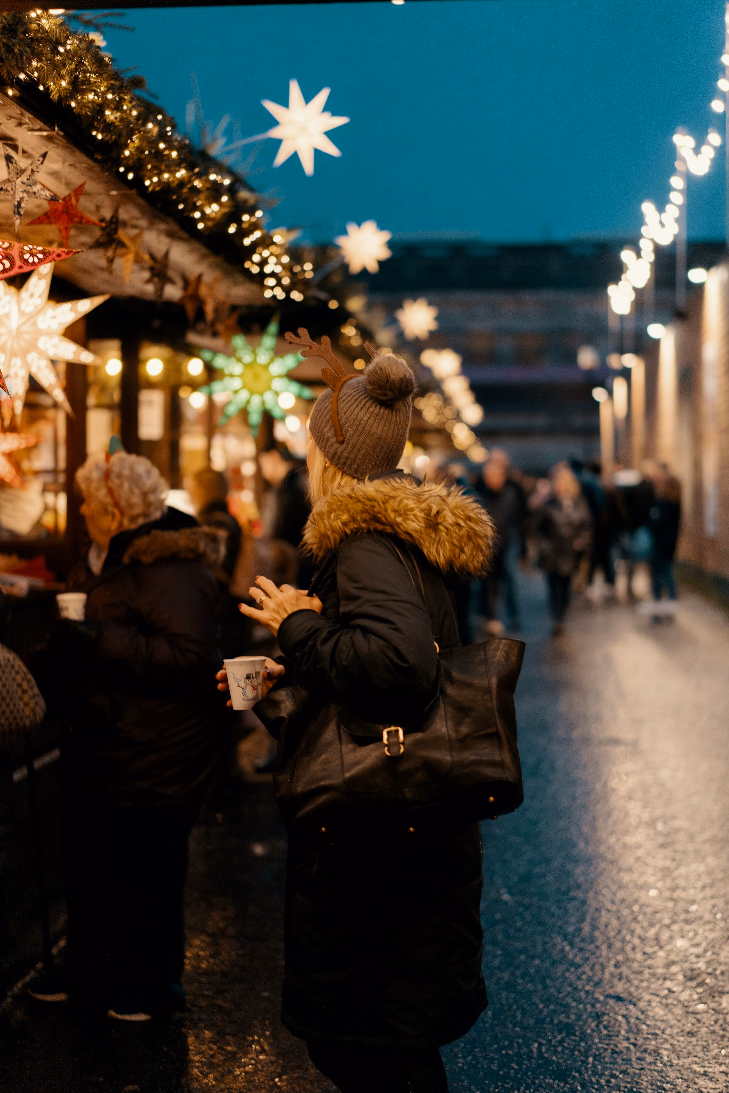 Shoppers at Edinburgh's Christmas market stalls