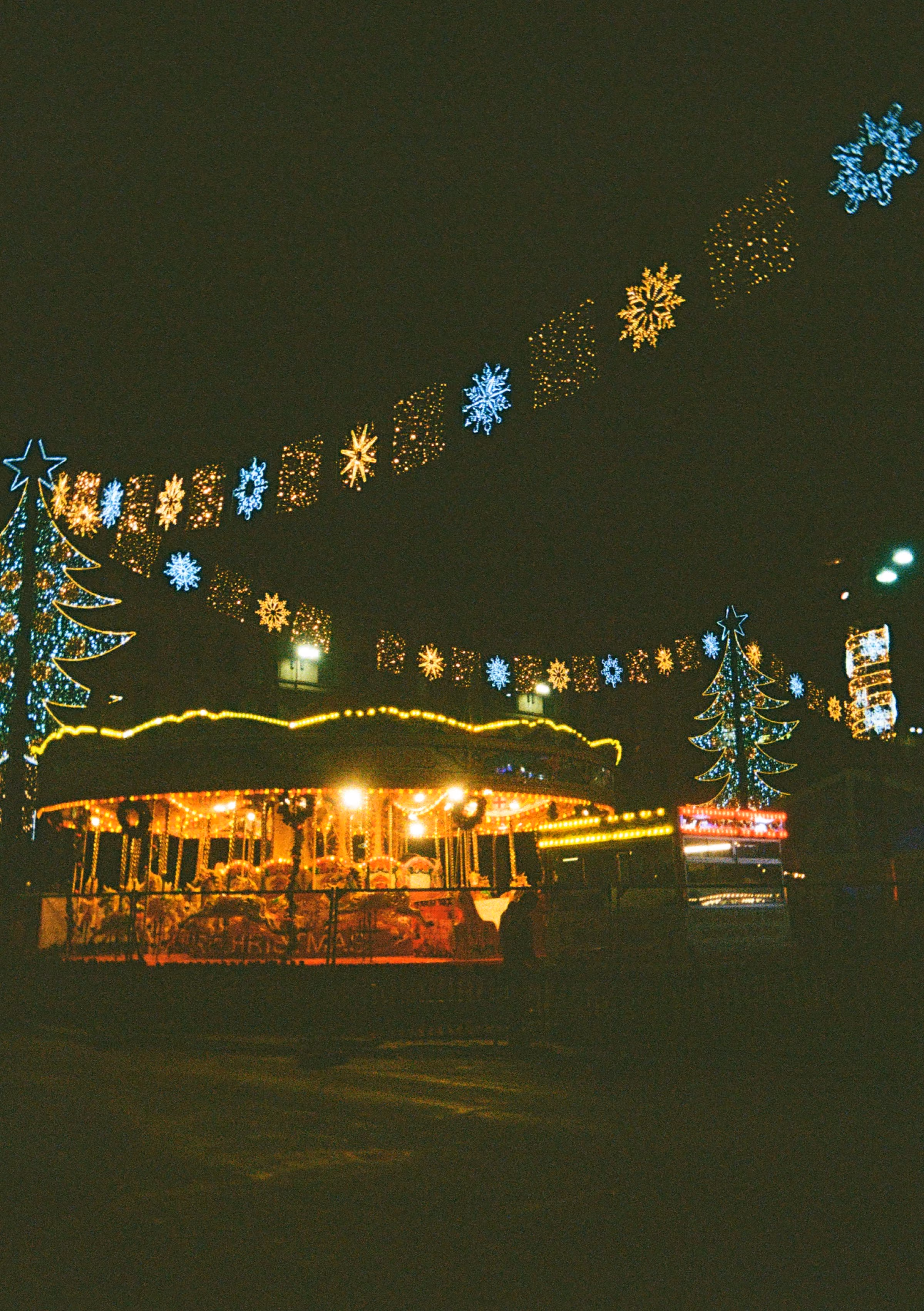 A carousel under festive lights in Glasgow